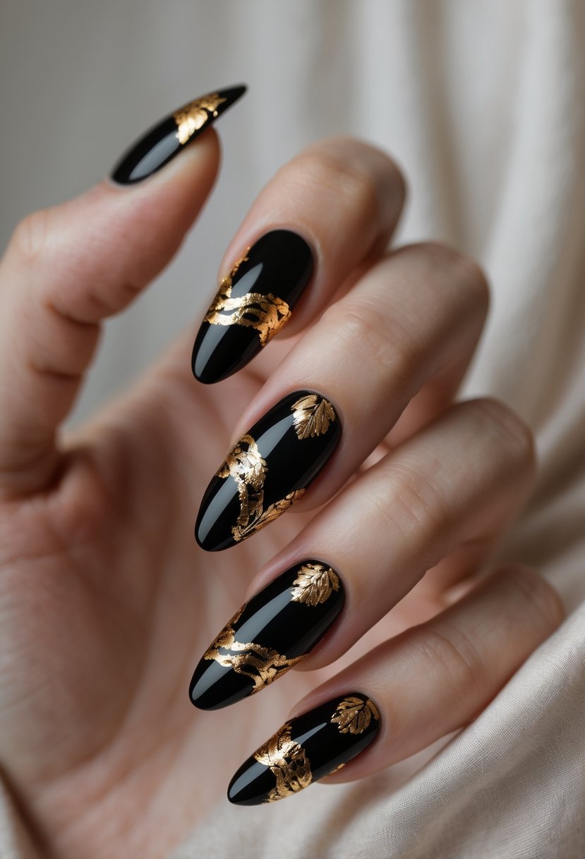 A close-up of a hand with glossy black nails featuring gold foil accents.