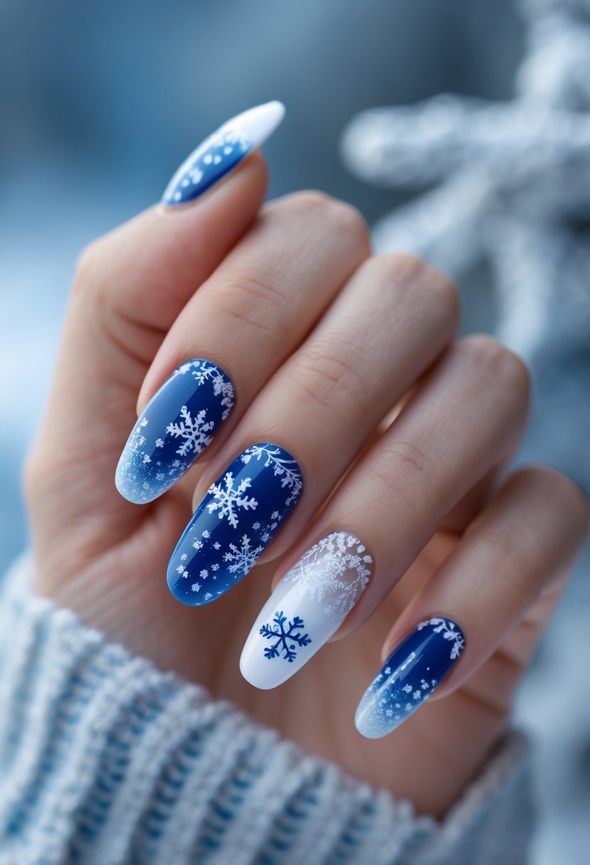 A close-up of a hand with blue and white French tip nails decorated with winter-themed designs like snowflakes.